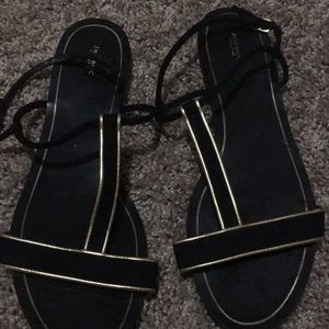 Zara T strap sandals in black and gold